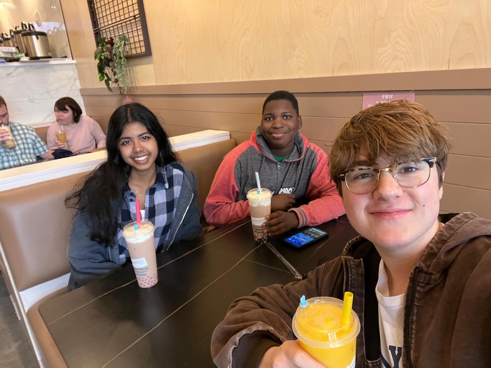 group photo at a boba shop.